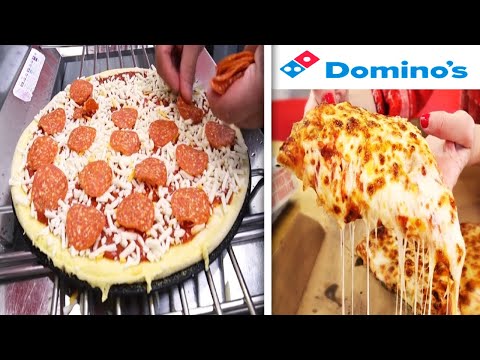 ¿cuántas porciones tiene una pizza grande de dominos?